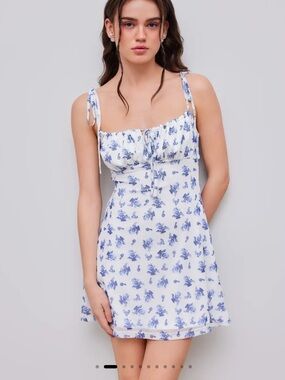 Cider mesh scoop neckline floral knotted mini dress